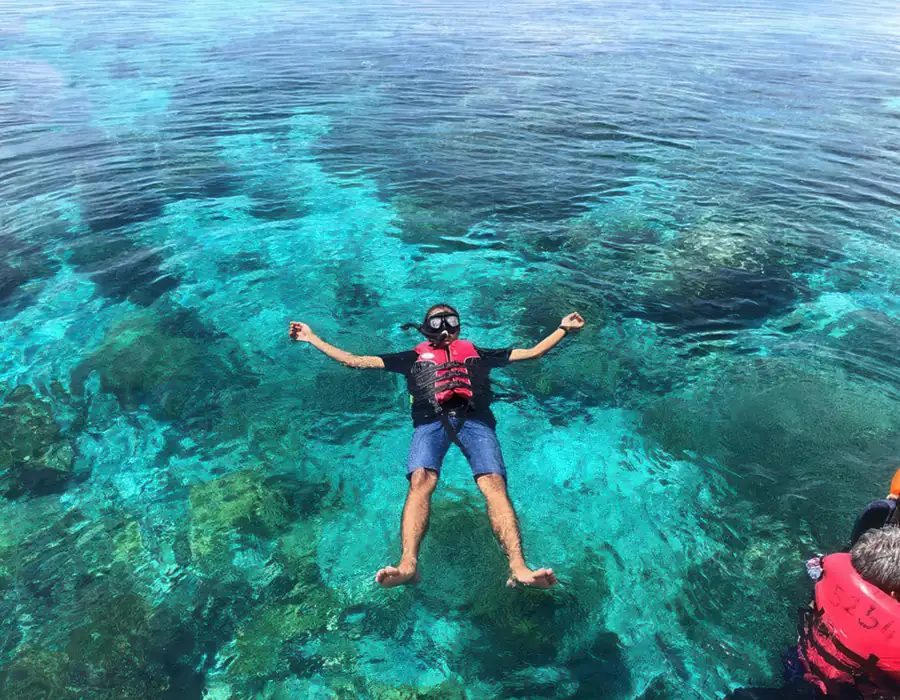 Snorkelling in the clear waters of the Celebes Sea near Blue Ocean Resort, Semporna